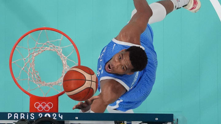 Jul 30, 2024; Villeneuve-d'Ascq, France; Greece small forward Giannis Antetokounmpo (34) shoots against Spain in a men's basketball group stage match during the Paris 2024 Olympic Summer Games at Stade Pierre-Mauroy. Mandatory Credit: John David Mercer-USA TODAY Sports