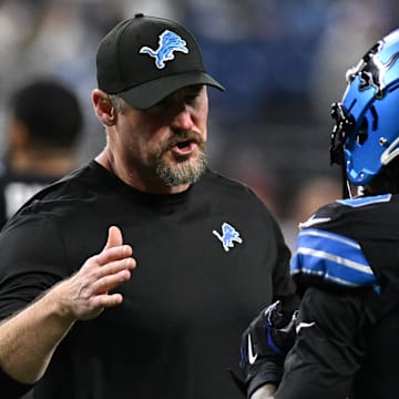 Detroit Lions head coach Dan Campbell greets wide receiver Jameson Williams (9) during pregame warmups 