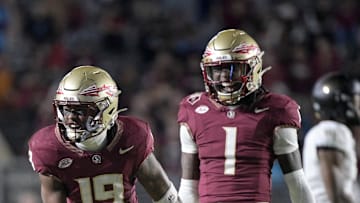 Nov 1, 2025; Tallahassee, Florida, USA; Florida State Seminoles defensive back Jerry Wilson (19) celebrates a big tackle with defensive back Shyheim Brown (1) during the second half at Doak S. Campbell Stadium. Mandatory Credit: Melina Myers-Imagn Images