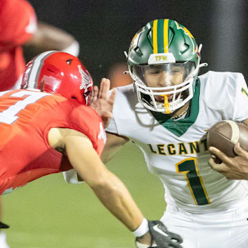 Lecanto wide receiver Braylen Moore (1) tries to get away from Bradford Branden Williams (17) as Bradford takes on Lecanto at Bradford High School in Starke, FL on Friday, October 20, 2023. [Alan Youngblood/Gainesville Sun]