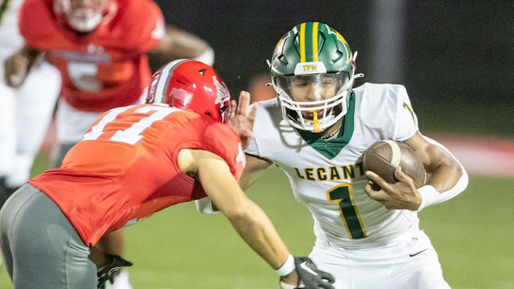 Lecanto wide receiver Braylen Moore (1) tries to get away from Bradford Branden Williams (17) as Bradford takes on Lecanto at Bradford High School in Starke, FL on Friday, October 20, 2023. [Alan Youngblood/Gainesville Sun]