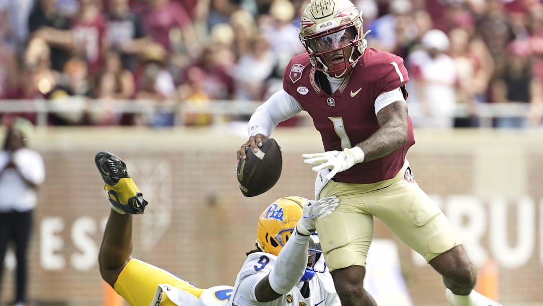 Oct 11, 2025; Tallahassee, Florida, USA; Florida State Seminoles quarterback Thomas Castellanos (1) looks to throw as he is pressured by Pittsburgh Panthers linebacker Kyle Louis (9) during the first half at Doak S. Campbell Stadium. Mandatory Credit: Melina Myers-Imagn Images