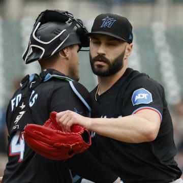 May 15, 2024; Detroit, Michigan, USA; Miami Marlins catcher Nick Fortes (4) and pitcher Tanner Scott (66) celebrate after defeating the Detroit Tigers at Comerica Park. Mandatory Credit: Rick Osentoski-USA TODAY Sports