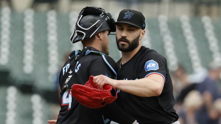 May 15, 2024; Detroit, Michigan, USA; Miami Marlins catcher Nick Fortes (4) and pitcher Tanner Scott (66) celebrate after defeating the Detroit Tigers at Comerica Park. Mandatory Credit: Rick Osentoski-USA TODAY Sports