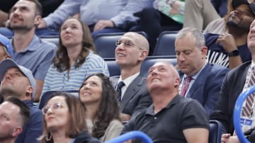 Apr 2, 2025; Oklahoma City, Oklahoma, USA; NBA Commissioner Adam Silver, center,during a time out between the Detroit Pistons and Oklahoma City Thunder at Paycom Center. Mandatory Credit: Alonzo Adams-Imagn Images