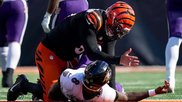 Cincinnati Bengals defensive end Trey Hendrickson (91) gestures to Baltimore Ravens quarterback Lamar Jackson (8) after tackling him in the fourth quarter of the NFL Week 5 game between the Cincinnati Bengals and Baltimore Ravens at Paycor Stadium in downtown Cincinnati on Sunday, Oct. 6, 2024. The Bengals fell to 1-4 on the season with a 41-38 loss to the Ravens.