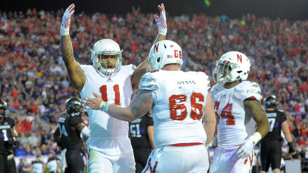 Nebraska Cornhuskers tight end Cethan Carter (11) celebrates his touchdown with teammates against the Northwestern Wildcats.