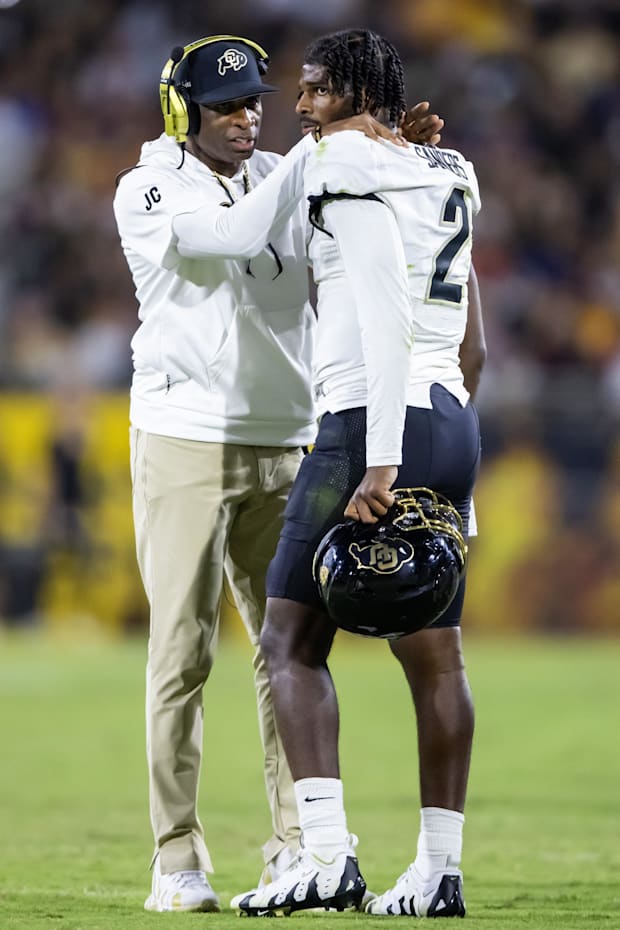 Oct 7, 2023; Tempe, Arizona, USA; Colorado Buffaloes head coach Deion Sanders with son and quarterback Shedeur Sanders (2) ag