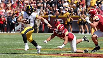 Sep 6, 2025; Ames, Iowa, USA; Iowa Hawkeyes quarterback Mark Gronowski (11) runs with the ball against the Iowa State Cyclones during the second quarter at Jack Trice Stadium. Mandatory Credit: Reese Strickland-Imagn Images