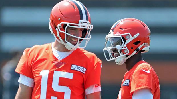 Browns quarterbacks Joe Flacco (15) and Shedeur Sanders chat during practice, Wednesday, June 11, 2025, in Berea.