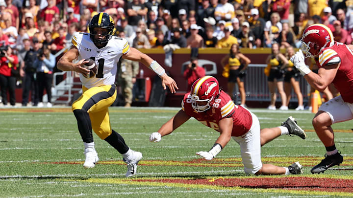 Sep 6, 2025; Ames, Iowa, USA; Iowa Hawkeyes quarterback Mark Gronowski (11) runs with the ball against the Iowa State Cyclones during the second quarter at Jack Trice Stadium. Mandatory Credit: Reese Strickland-Imagn Images
