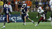 Sep 20, 2025; Charlottesville, Virginia, USA; Virginia Cavaliers quarterback Chandler Morris (4) passes the ball to Cavaliers wide receiver Cam Ross (6) as Stanford Cardinal linebacker Ese Dubre (30) chases during the second quarter at Scott Stadium. Mandatory Credit: Geoff Burke-Imagn Images