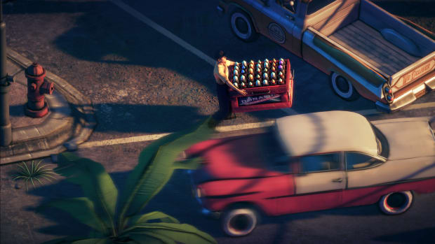 A red and white 1950s car passing by a man carrying a crate with fireworks.