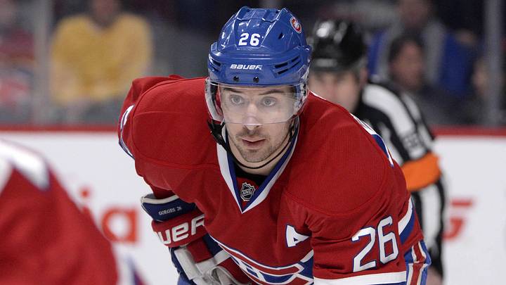 Jan 28, 2014; Montreal, Quebec, CAN; Montreal Canadiens defenseman Josh Gorges (26) gets ready for a face off during the first period against the Carolina Hurricanes at the Bell Centre. The Montreal Canadiens defeated the Carolina Hurricanes 3-0. Mandatory Credit: Eric Bolte-Imagn Images