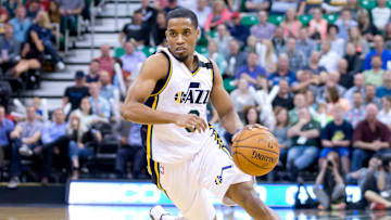Apr 13, 2015; Salt Lake City, UT, USA; Utah Jazz guard Bryce Cotton (8) dribbles the ball during the second half against the Dallas Mavericks at EnergySolutions Arena. The Jazz won 109-92. Mandatory Credit: Russ Isabella-Imagn Images