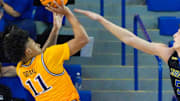 Drexel's Jason Drake shoots against the defense of Delaware's Macon Emory (5) in the second half of Delaware's 78-74 loss at the Bob Carpenter Center, Thursday, Feb. 20, 2025.
