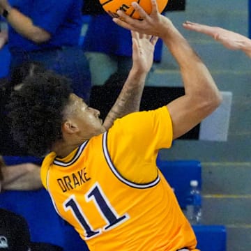 Drexel's Jason Drake shoots against the defense of Delaware's Macon Emory (5) in the second half of Delaware's 78-74 loss at the Bob Carpenter Center, Thursday, Feb. 20, 2025.
