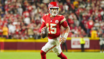 Oct 7, 2024; Kansas City, Missouri, USA; Kansas City Chiefs quarterback Patrick Mahomes (15) rolls out to pass during the first half against the New Orleans Saints at GEHA Field at Arrowhead Stadium.