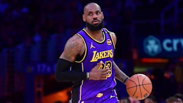 Feb 25, 2025; Los Angeles, California, USA; Los Angeles Lakers forward LeBron James (23) dribbles the ball against the Dallas Mavericks during the second half at Crypto.com Arena. Mandatory Credit: Gary A. Vasquez-Imagn Images