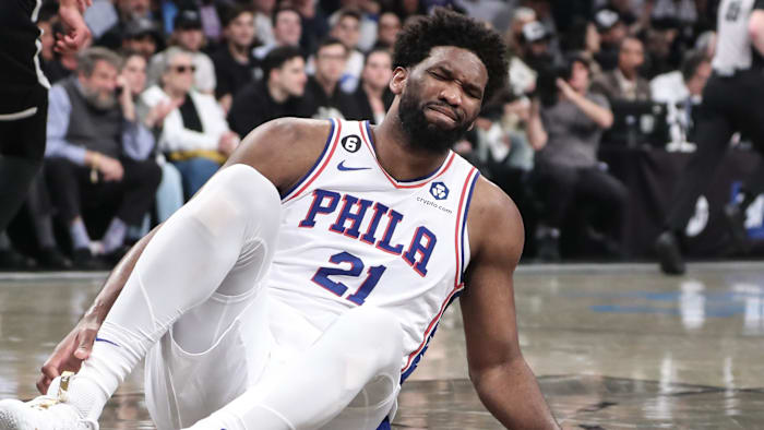 Apr 20, 2023; Brooklyn, New York, USA; Philadelphia 76ers center Joel Embiid (21) grimaces after