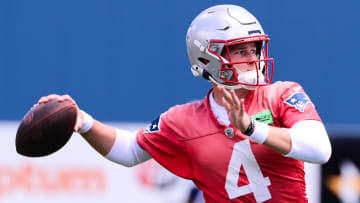 Jun 10, 2024; Foxborough, MA, USA; New England Patriots quarterback Bailey Zappe (4) throws a pass at minicamp at Gillette Stadium. Mandatory Credit: Eric Canha-USA TODAY Sports