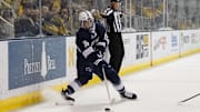 Penn State forward Aiden Fink handles the puck during a Big Ten Tournament game vs. Michigan Wolverines at Yost Ice Arena. 