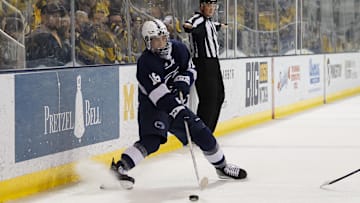 Penn State forward Aiden Fink handles the puck during the second period against the Michigan Wolverines at Yost Ice Arena. 