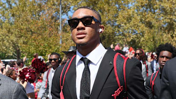 Sep 14, 2024; Fayetteville, Arkansas, USA; Arkansas Razorbacks quarterback Taylen Green (center) and defensive end Landon Jackson (right) during the Hog Walk prior to the game against the UAB Blazers at Donald W. Reynolds Razorback Stadium. Mandatory Credit: Nelson Chenault-Imagn Images
