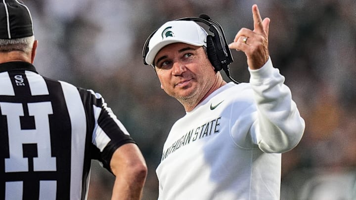Michigan State head coach Jonathan Smith talks to a referee regarding a call during the first half against Western Michigan at Spartan Stadium in East Lansing on Friday, August 29, 2025.