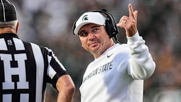 Michigan State head coach Jonathan Smith talks to a referee regarding a call during the first half against Western Michigan at Spartan Stadium in East Lansing on Friday, August 29, 2025.
