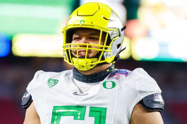 Logan Sagapolu  is shown wearing an Oregon uniform at the 2021 Fiesta Bowl. 