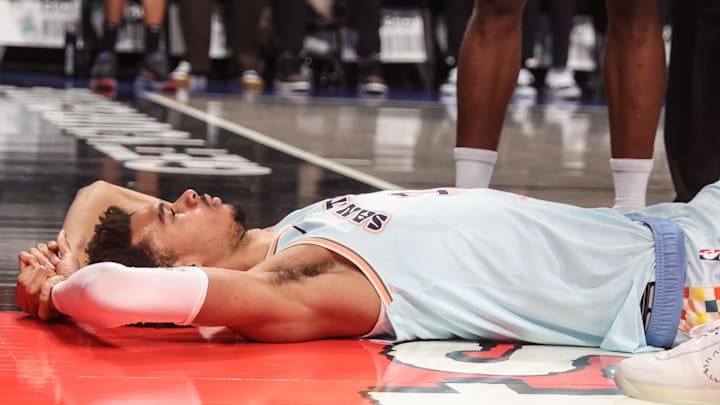 Dec 27, 2024; Brooklyn, New York, USA; San Antonio Spurs center Victor Wembanyama (1) lays on the court after getting fouled in the third quarter against the Brooklyn Nets at Barclays Center. Dec 27, 2024; Brooklyn, New York, USA; San Antonio Spurs center Victor Wembanyama (1) lays on the court after getting fouled in the third quarter against the Brooklyn Nets at Barclays Center.