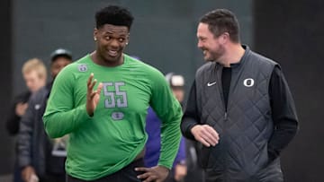 Oregon offensive lineman Marcus Harper II, left, talks to Oregon head coach Dan Lanning during the Oregon football’s Pro Day Tuesday, March 18, 2025, at the Moshofsky Center in Eugene, Ore.