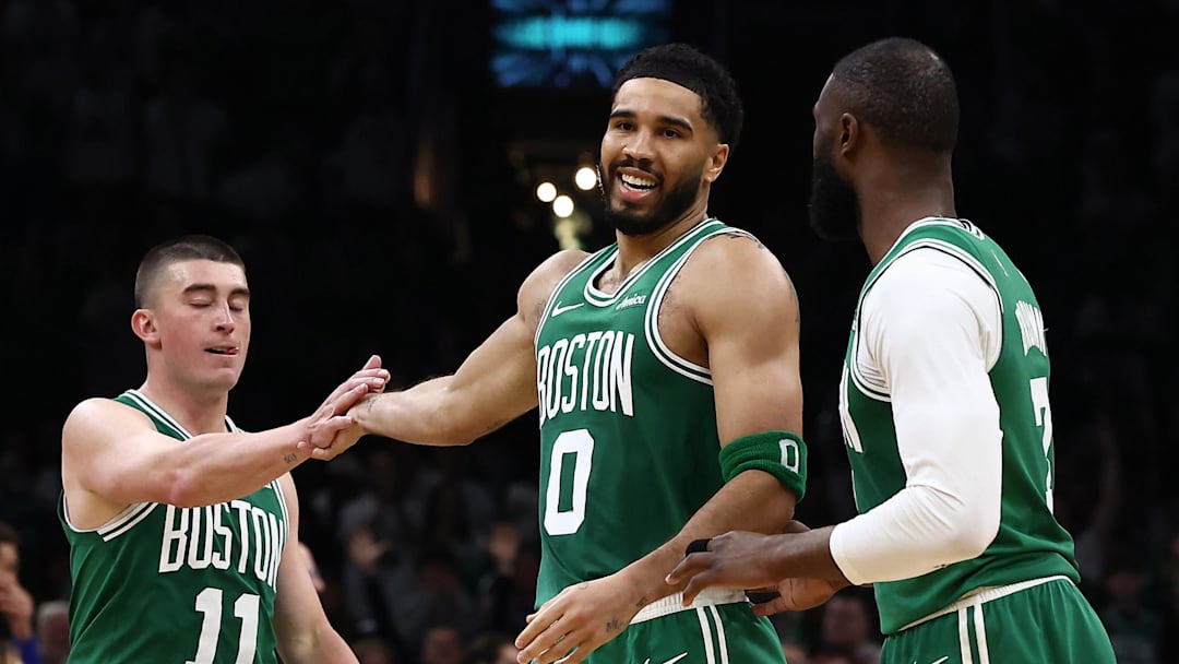 Mar 6, 2026; Boston, Massachusetts, USA; Boston Celtics forward Jayson Tatum (0) smiles at Boston Celtics guard Jaylen Brown (7) while being congratulated by guard Payton Pritchard (11) during the second half at TD Garden. Mandatory Credit: Winslow Townson-Imagn Images