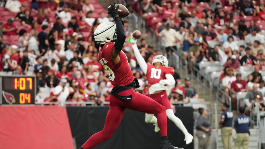 Arizona Cardinals receiver Marvin Harrison Jr. (18) catches a pass in the end. zone during training camp at State Farm Stadium in Glendale, Ariz., on Saturday, Aug. 3, 2024.