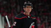 Apr 7, 2024; Raleigh, North Carolina, USA;  Carolina Hurricanes center Evgeny Kuznetsov (92) looks on against the Columbus Blue Jackets during the first period at PNC Arena. Mandatory Credit: James Guillory-Imagn Images