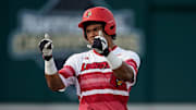 Louisville designated hitter Zion Rose (32) celebrates his RBI-double against Vanderbilt during the first inning at Hawkins Field in Nashville, Tenn., Tuesday, May 7, 2024.
