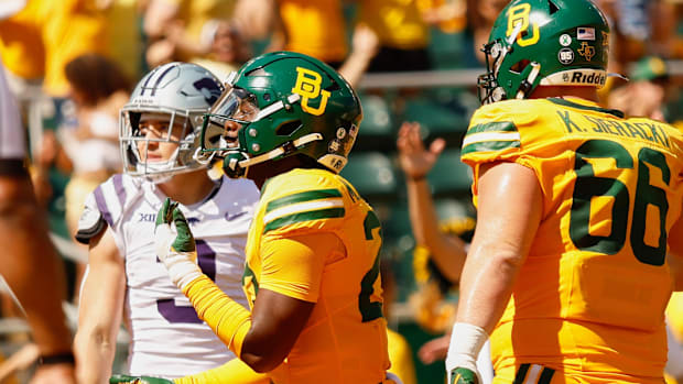  Baylor Bears running back Michael Turner (23) celebrates after scoring a touchdown against the Kansas State Wildcats 