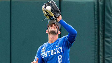 Jun 19, 2024; Omaha, NE, USA; Kentucky Wildcats outfielder Ty Crittenberger (8) gets an out against the Florida Gators during the seventh inning at Charles Schwab Field Omaha. Mandatory Credit: Dylan Widger-Imagn Images