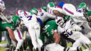 Philadelphia Eagles quarterback Jalen Hurts scores a touchdown on a sneak play against the Buffalo Bills.
