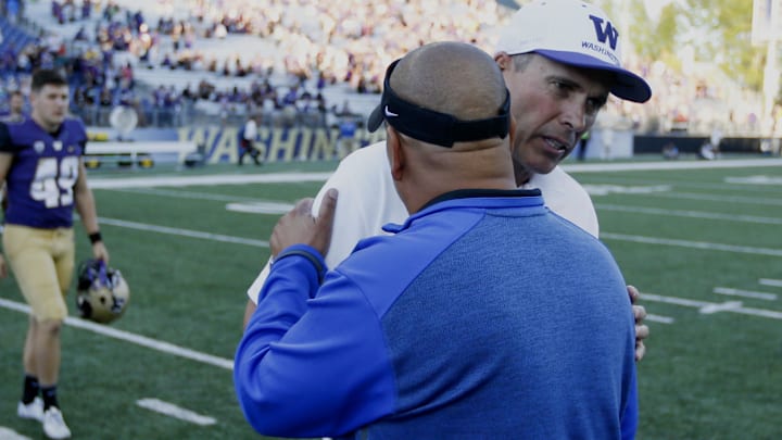 Sep 20, 2014; Seattle, WA, USA; Washington Huskies head coach Chris Petersen shakes hands with Georgia State Panthers head coach Trent Miles following a 45-14 Washington victory at Husky Stadium. Mandatory Credit: Joe Nicholson-Imagn Images