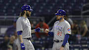 May 26, 2021; Pittsburgh, Pennsylvania, USA;  Chicago Cubs starting pitcher Trevor Williams (32) is greeted by first base coach Craig Driver (81) after hitting a single against the Pittsburgh Pirates during the sixth inning at PNC Park. Mandatory Credit: Charles LeClaire-Imagn Images