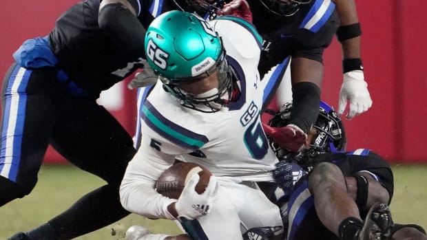 Ramsay tacklers combine to bring down Gulf Shores' Ronnie Royal (2) during the 5A AHSAA State Championship Game 