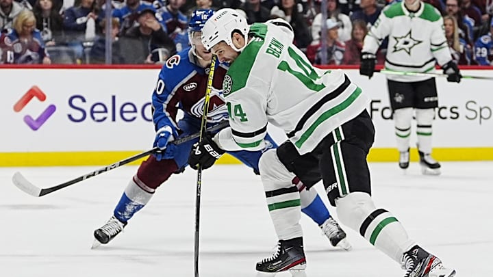 Mar 25, 2025; Denver, Colorado, USA; Dallas Stars left wing Jamie Benn (14) shoots the puck in the first period against the Colorado Avalanche at Ball Arena. Mandatory Credit: Ron Chenoy-Imagn Images