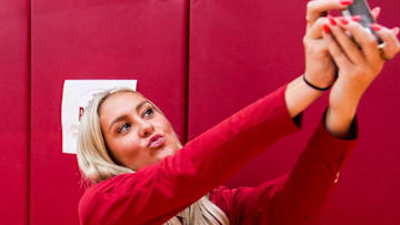 Indiana Hoosiers guard Sydney Parrish (33) takes a selfie Wednesday, Sept. 18, 2024, during IU men’s and women’s basketball media day at Simon Skjodt Assembly Hall in Bloomington.