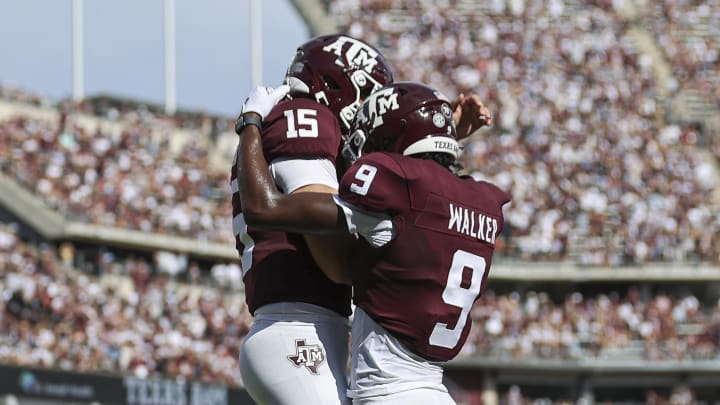 Sep 16, 2023; College Station, Texas, USA; Texas A&M Aggies quarterback Conner Weigman (15) and wide receiver Jahdae Walker (9) celebrate after a touchdown during the first quarter against the Louisiana Monroe Warhawks at Kyle Field. Mandatory Credit: Troy Taormina-USA TODAY Sports