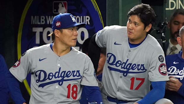 Los Angeles Dodgers starting pitchers Yoshinobu Yamamoto, left, and Shohei Ohtani.