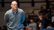 Penn State head wrestling coach Cael Sanderson looks on during a video review at a dual meet against Ohio State.