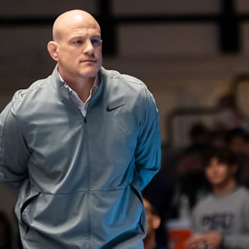 Penn State head wrestling coach Cael Sanderson looks on during a video review at a dual meet against Ohio State.
