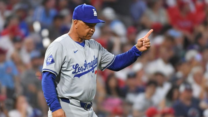 Jul 10, 2024; Philadelphia, Pennsylvania, USA; Los Angeles Dodgers manager Dave Roberts (30) signals to the bullpen to make a pitching change against the Philadelphia Phillies at Citizens Bank Park. Mandatory Credit: Eric Hartline-USA TODAY Sports